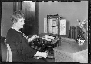 Demonstrating use of typewriter work holder, Los Angeles, CA, 1933