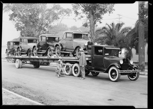 Fords on big trailer, Southern California, 1930