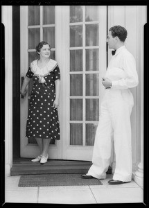 Service man at door of home, Southern California, 1932