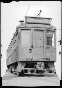 Bus, yellow and red car, Southern California, 1931