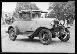 Ford coupe showing damage, Southern California, 1931