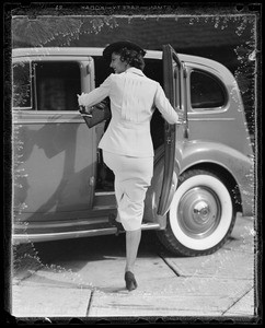 Girl walking and getting into car, Southern California, 1935