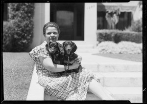 Mrs. Giles and dachshunds, Southern California, 1935