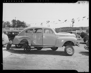 Damaged 1940 Dodge and intersection of Hildreth Avenue and Tenaya Avenue, Southern California, 1940