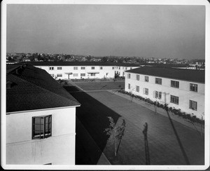 Wyvernwood Housing complex with 2-story units divided by greenbelt and walkways