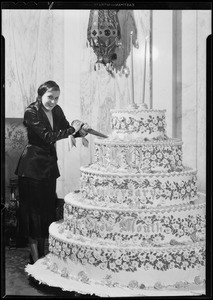 Miss Dodge cutting 2nd Anniversary cake, Orpheum Theater, Southern California, 1931