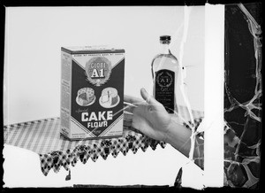 Hand reaching for package of cake flour, Southern California, 1936