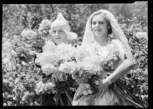 Spanish and Dutch girls with dahlias, Southern California, 1932