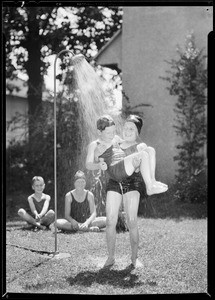 Lawn shower for kiddies with Edward and youngsters, May Co., Southern California, 1931