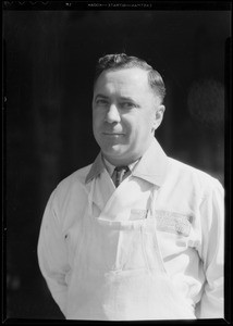 Portrait of Mr. Reno Guasti, manager of meat market at 3915 West 10th Street