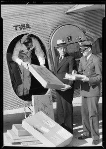 Receiving shipment by TWA, Southern California, 1934