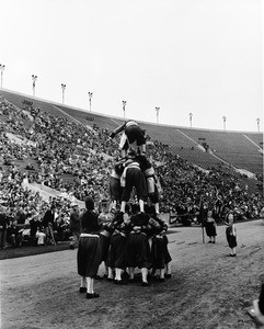 Shrine parade at Coliseum featuring human pyramid