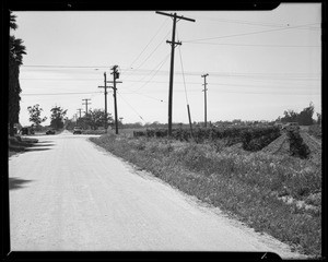 Views at South Figueroa Street and West 157th Street and 1939 Mercury sedan, Los Angeles, CA, 1940