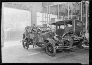 Wrecked Ford - which went into ocean, taken at garage 214 West 17th Street, Los Angeles, CA, 1929