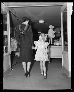 Child and mother in infants department at May Co, Southern California, 1940