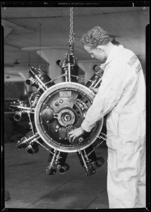 Man and aeroplane motor, Southern California, 1935