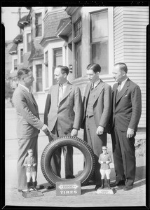 Group of men and Hood tire, Southern California, 1934