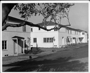 Wyvernwood Housing complex with 2-story units divided by greenbelt and walkways