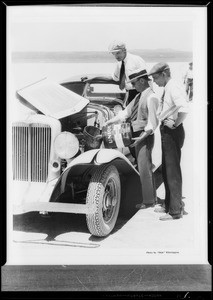 Earl Cooper, etc., with Auburn at dry lake, Southern California, 1932