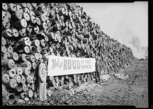 Wall of discarded heater tanks, Southern California, 1930