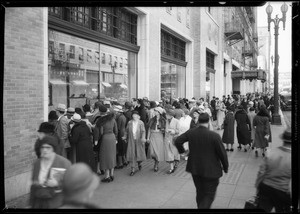 Crowd looking at store window, Southern California, 1933