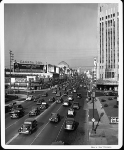 Looking at the Wiltern Theatre from a high-angle along with the its immediate street scene surroundings