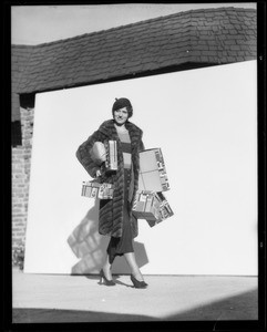 Woman with Christmas boxes, Southern California, 1932