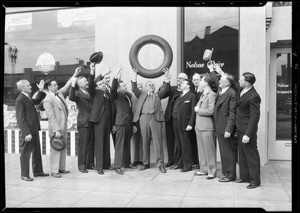 Salesman getting the 'dope' on new tire, Southern California, 1931