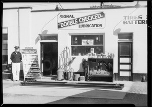 Correct and incorrect lubrication rack at Wilshire Boulevard and South Gale Drive station, Beverly Hills, CA, 1935