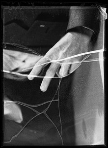 Hand with two fingers raised for composite, Southern California, 1935