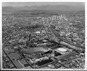 An aerial view looking northeast over the Coliseum toward downtown Los Angeles