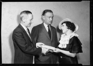 Mr. Karl & woman receiving check, Southern California, 1935