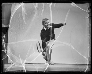 Mickey Riley playing tennis, Southern California, 1936