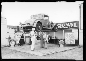 Tarzan boys helping on grease rack, Southern California, 1933