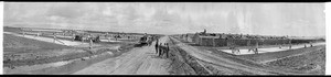 Constructing buildings in empty field, Southern California