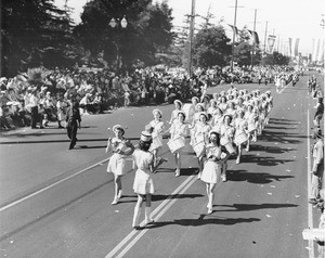 A women's marching band participating in an enormous parade