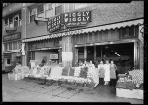 Fruit and vegetable stand and group, Southern California, 1934