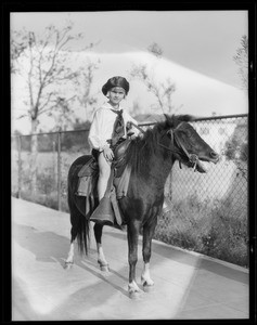 Monkey and horse, Southern California, 1928