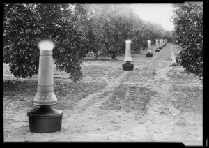 Citrus smudge pots, Southern California, 1928