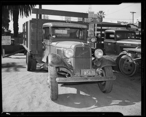 Damage to Ford truck and intersection of West Pico Boulevard and South Grand Avenue, Los Angeles, CA, 1940