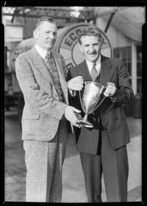 Mr. Smith and other man with loving cup, Southern California, 1932