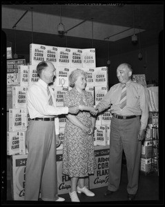 Presenting check to Sam Seelig at Seelig Market, Inglewood, CA, 1940