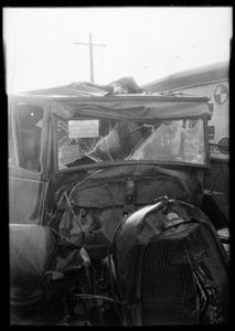 Triplex glass in wrecked Ford at Merney's Garage, Southern California, 1929