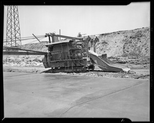 Concrete mixer in Los Angeles River bed & Graham Brothers truck, Southern California, 1940