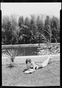 Photograph of Margaret Hoffman by bathing pool, Southern California, 1929