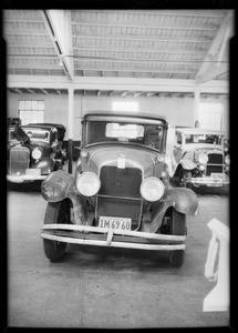 Damaged Buick sedan and Studebaker coupe from accident at intersection of Melrose Avenue and North Las Palmas Avenue, Southern California, 1934