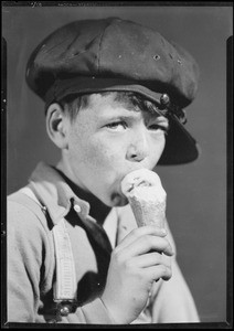 Boy eating ice cream cone, Southern California, 1932