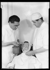 Putting cast on patient, Southern California, 1932