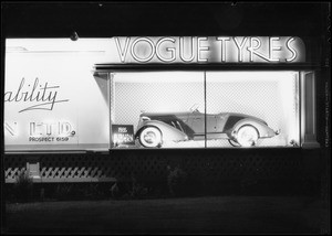 Vogue Tyre board with Auburn roadster, Southern California, 1935