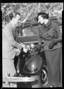 Man and woman posing with car, Southern California, 1934